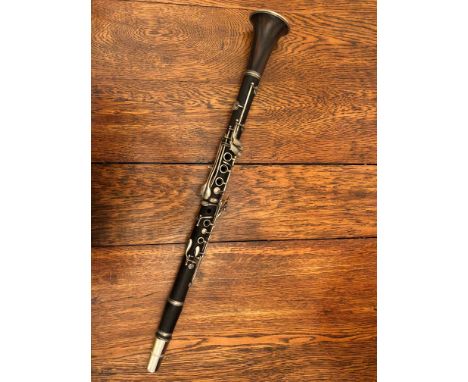 A cased mid-20thC rosewood clarinet by Cabart of Paris.
