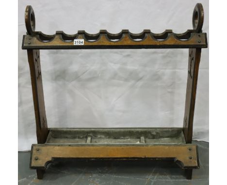 A large 19th century seven-stick stand in walnut, of gothic inspired construction, with drip tray, 72 x 29 x 73 cm. Not avail