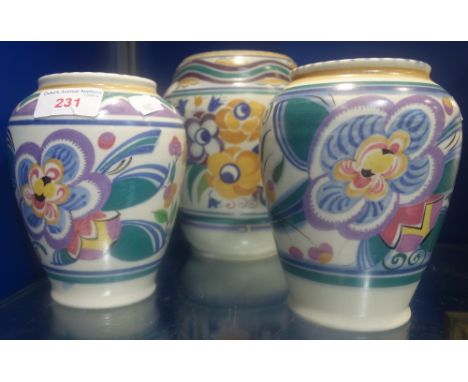A PAIR OF POOLE POTTERY " LEON THE LION" TRADITIONAL VASES, shape no. 178, painted in polychrome, and a Poole Pottery YON pat