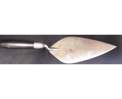 A BRICKLAYER'S CEREMONIAL SILVER TROWEL with wooden handle
