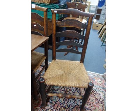 A COLLECTION OF EIGHT SIMILAR  COUNTRY LADDER BACK CHAIRS, WITH RUSH SEATS
