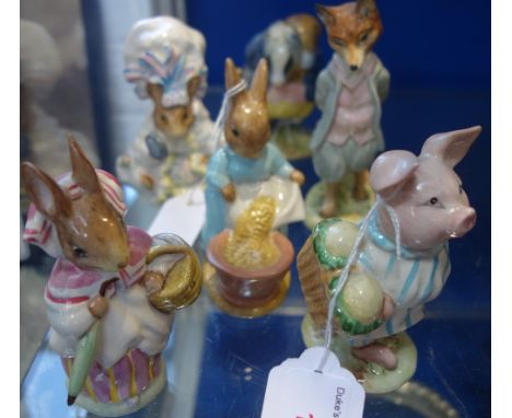 A COLLECTION OF BESWICK BEATRIX POTTERS CERAMIC FIGURES, including Little Pig Robinson, Mrs Rabbit, Tommy Brock, Lady Mouse f