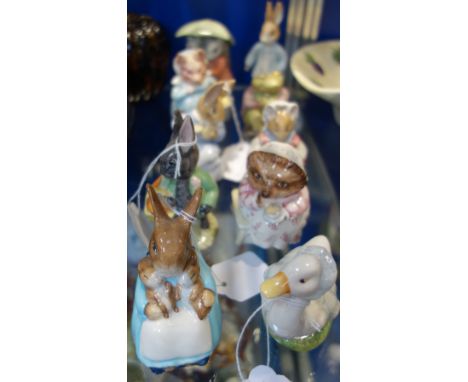 A COLLECTION OF BESWICK BEATRIX POTTERS CERAMIC FIGURES, including Mrs Rabbit and Bunnies, Mrs Tiggy Winkle Takes Tea, Aunt P