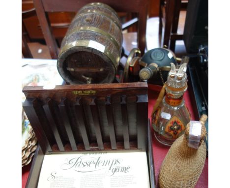 AN OAK STAVED BRANDY BARREL ON STAND, a four section decanter, a Courvoisier brandy 'Cannon' stand and other items