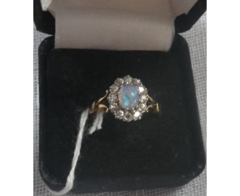 AN OPAL AND DIAMOND RING on an 18ct yellow gold shank, ring size M