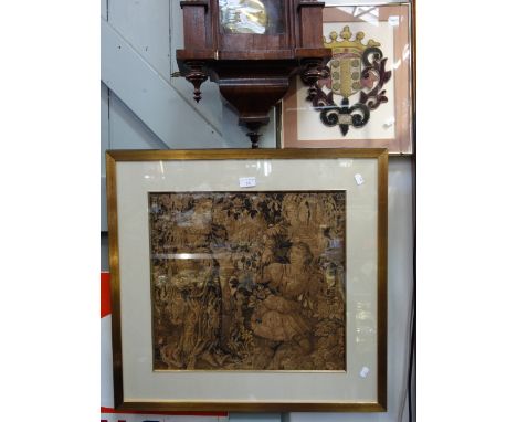 A FRAMED FRAGMENT OF TAPESTRY of a couple in a garden, a velvet and silk cut-out Coat of Arms and a framed textile picture