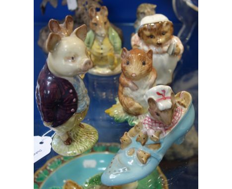 A COLLECTION OF BESWICK BEATRIX POTTERS CERAMIC FIGURES, including The Old Woman Who Lived In A Shoe, Pigling Bland, Tailor o