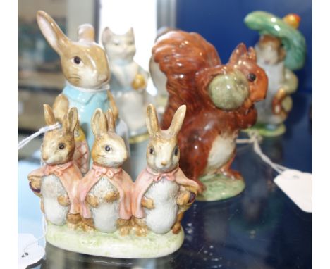 A COLLECTION OF BESWICK BEATRIX POTTERS CERAMIC FIGURES, including Flopsy Mopsy and Cotton Tail, Squirrel Nutkin, Benjamin Bu