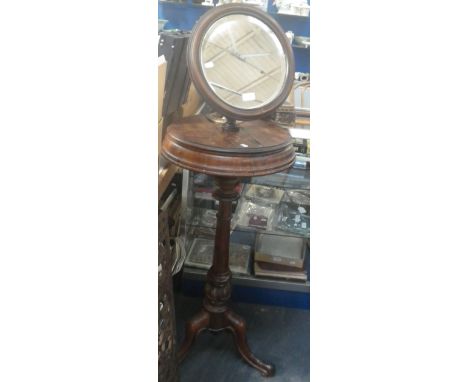 A VICTORIAN ASH SHAVING STAND WITH LIFT-UP COMPARTMENTS  AND CIRCULAR MIRROR, ON TRIPOD SUPPORT