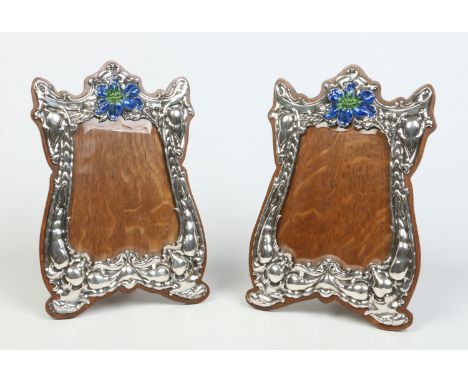 A large pair of matched Art Nouveau silver eizel photograph frames, one by George Nathan & Ridley Hayes, the other H. Emanuel