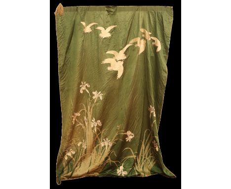 A large Japanese silk embroidered wall hanging. Green ground and decorated with cranes in flight and irises, 1m 66cm x 2m .  