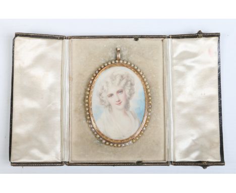 A 15 carat gold cased ivory portrait miniature brooch / pendant studded with seed pearls. Portrait of a young woman, with eng