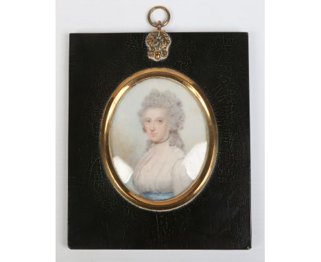 English school, an early 19th century ivory portrait miniature in ebonized frame. Portrait of a young woman. Remnants of an o