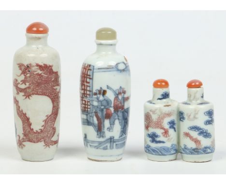 Three 19th century Chinese snuff bottles, one formed from two adjoined bottles, decorated in underglaze blue and copper red a