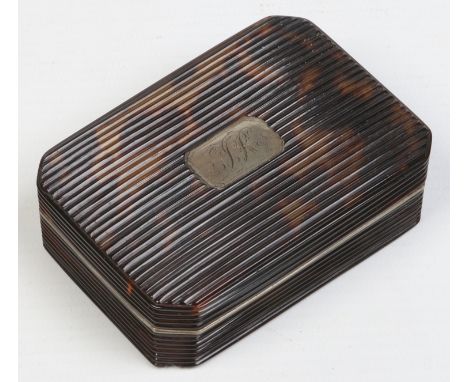 A Georgian tortoiseshell snuff box of reeded rectangular form, with canted corners and white metal mounts. Cartouche inscribe