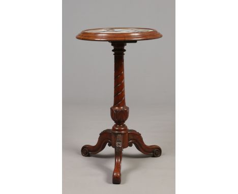 A Victorian carved mahogany tripod centre pedestal table with porphyry marble inlaid top depicting a bird and stylized leaves