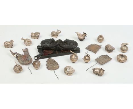 Fifteen Indian silver boxes formed as animals and fruit, a set of opium scales in carved and ebonized wooden case and sundry 