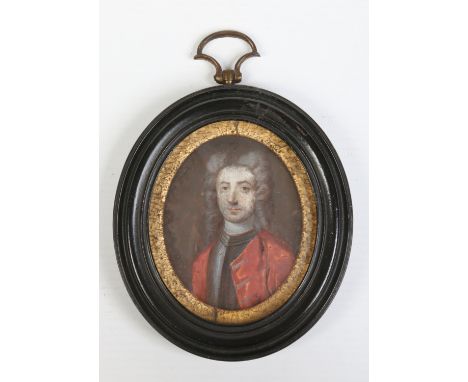 Antique English school ivory portrait miniature of a gentleman in 17th century attire; a cuirass and red overcoat with powder