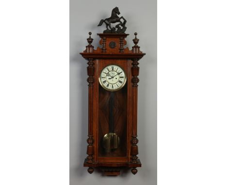 A 19th century Gustav Becker walnut cased Vienna wall clock. With enamel dial having subsidiary seconds and housing an 8 day 