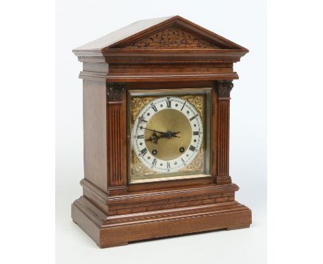 An oak cased 8 day bracket clock of architectural form by Winterhalder and Hoffmeier. Having gilt square dial with silvered c