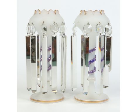 A pair of Victorian frosted glass lustres. With gilt castellated rims and each with an applied blue glass serpent decorated w