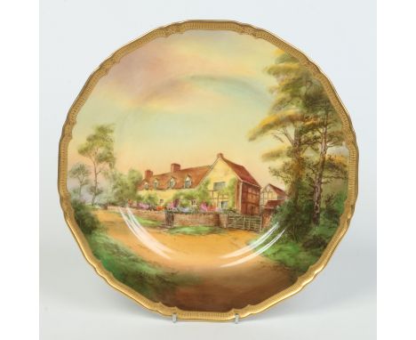 A Royal Worcester cabinet plate by Harry Ayrton. With a tooled gilt border and painted with a named view of Mary Arden's Hous