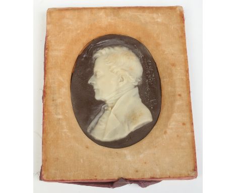 A large Victorian wax portrait of a gentleman, inscription indistinct with date 1859, 17cm x 13cm.