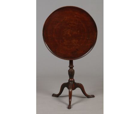 A 19th century mahogany tilt top tripod wine table. With dished top raised on a reeded tapering column and three scrolling su