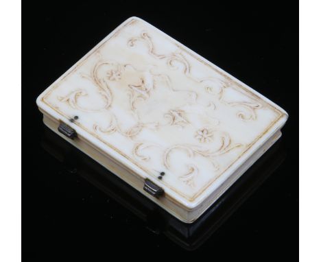 A 19th century European carved ivory snuff box with hinged cover decorated in relief with birds and scroll work, 7cm.   Condi