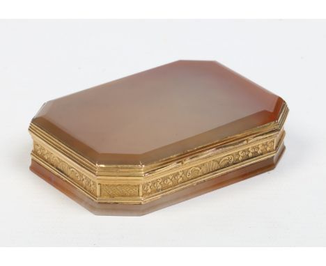 A 19th century agate snuff box of canted rectangular form with gilt metal mounts and hinged cover, 8.25cm wide.    Condition 