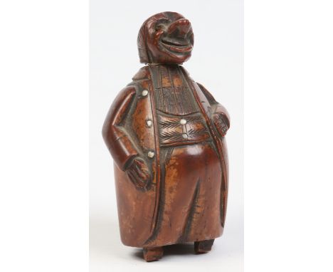 A late 18th / early 19th century French coquilla nut snuff box formed as a man wearing an overcoat, 8.5cm.   Condition Report