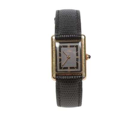 A ladies Cartier must de silver gilt quartz tank watch with cabochon sapphire crown. With grey dial having black chapter bear