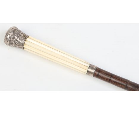 A Victorian stepped bamboo walking cane with fluted ivory grip and silver pommel. Assayed Birmingham 1896, 87.25cm long.   Co