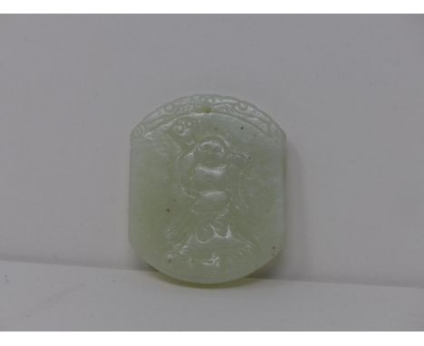 A Chinese white jade pendant, carved with Buddha to obverse, H.5.5 W.4.5cm 