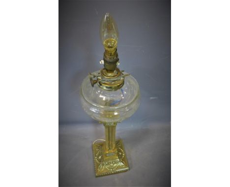 A brass column table lamp, decorated with tied ribbons and floral swags, with cut glass bowl, no shade, H.59cm 