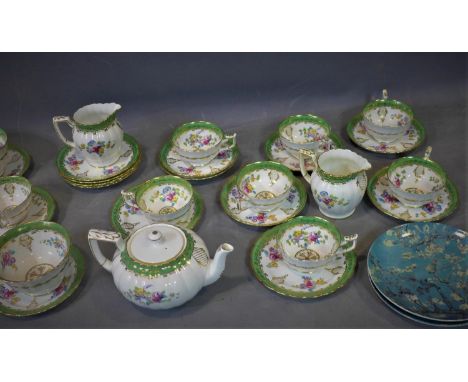 A hand painted tea service by Thomas Goode, comprising tea pot (1), creamer (2), tea cups (8), saucers (6) and side plates (8