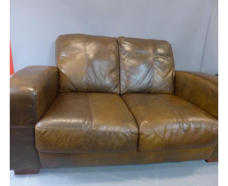 A brown two seater leather sofa, H.80 W.155 D.94cm 