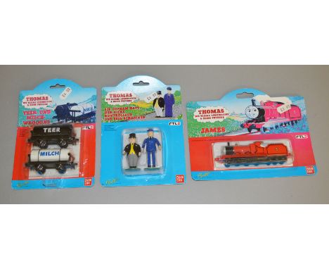 3 Bandai Thomas The Tank Engine carded models; James, Fat Controller &amp; Porter and 2 tanker wagons (3).