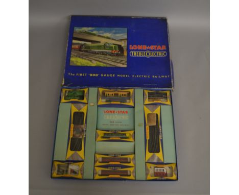 OOO Gauge. A scarce boxed Lone Star 'TrebleOlectric' EL53 Passenger and Accessories Train Set which contains various indiivid
