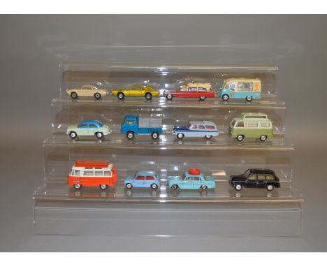 12 unboxed Corgi Toys with varying degrees of play wear including 202 Morris Cowley mid blue over off white, 428 Smiths Karri