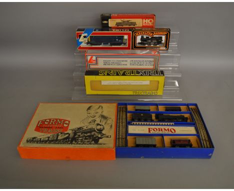 OO/HO Gauges. A vintage boxed 'Formo' Goods 3 rail Train Set, appears G+ in generally G box, together with  four boxed OO gau
