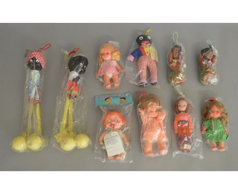 An interesting selection of vintage 'Made in Hong Kong' plastic and padded dolls, most appear to be housed in original plain 
