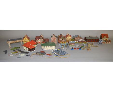 14 N scale Faller and other built buildings, along with 1 Brawa Ski Lift Unit (15).