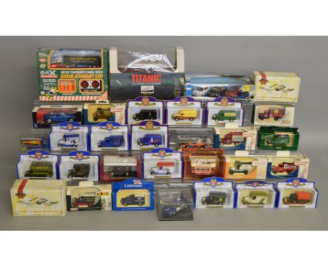 31 boxed diecast models by Oxford, Lledo, Matchbox and others including a Trofeu Subaru Rally model i and a Minichamps Arrows