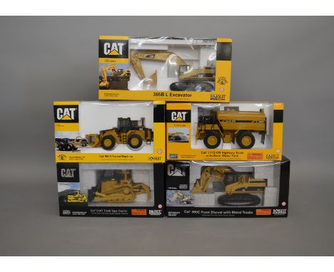 5 Caterpillar die-cast scale boxed models by Norscot, including; a collectable D10T Track Type Tractor, Forest Machine etc (5