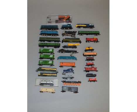N Gauge. EX SHOP STOCK 21 assorted rolling stock, mostly unboxed, together with 6 loose locomotives by; Lima, Bachmann etc (2