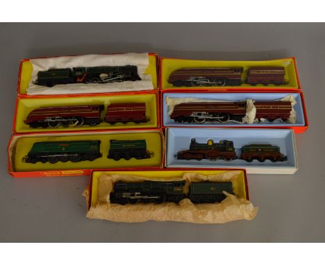 OO Gauge. 7 Tri-ang Hornby Locomotives including R.850 BR green 4-6-2 'Flying Scotsman', two LMS Maroon 4-6-2 'King George VI
