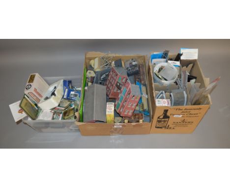 OO Gauge. A quantity of Model Railway Accessories, mostly unboxed trackside buildings, platform sections, vehicles, rolling s