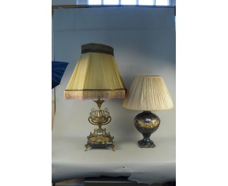 A dark blue and gilded pottery lamp base plus a gilded brass lamp base in the French Empire style on a black marble base on l