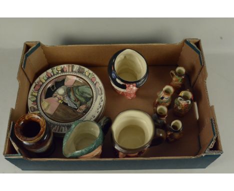 A collection of Royal Doulton items including a Doulton Lambeth vase, Toby jugs and plates including 'The Squire', 'The Hunti